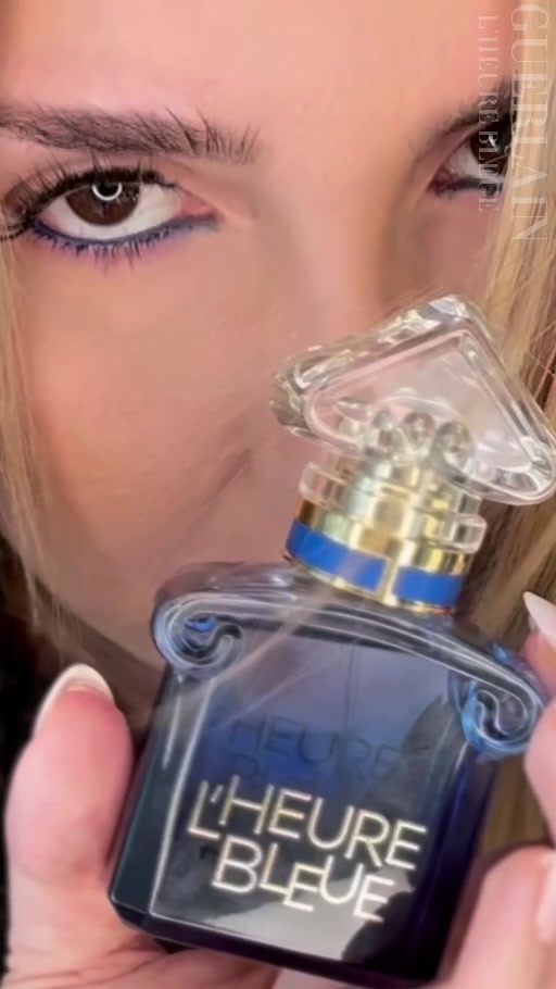Lena holding Guerlain L’Heure Bleue